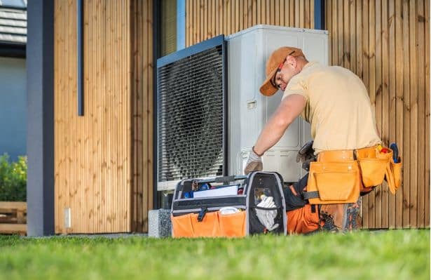 Technician Servicing Outdoor AC